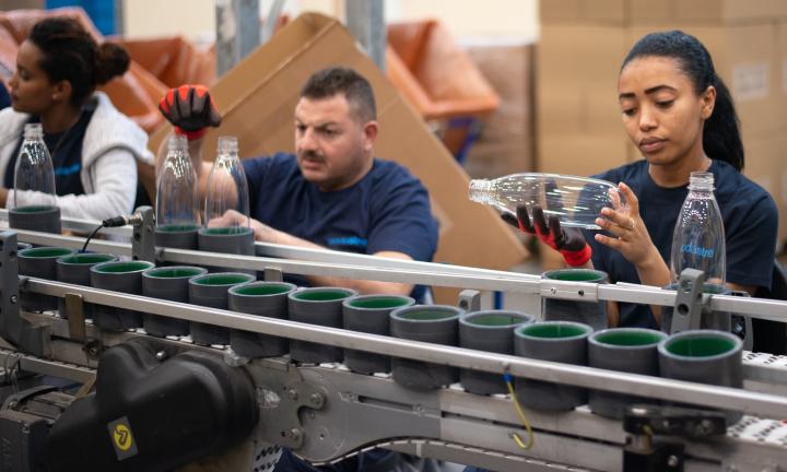 people working on assembly line Photo by Remy Geiling on Unsplash