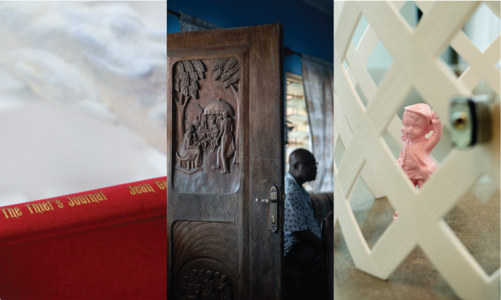 book in styrofoam, person next to carved wooden door, pink plastic sculpture behind white fence