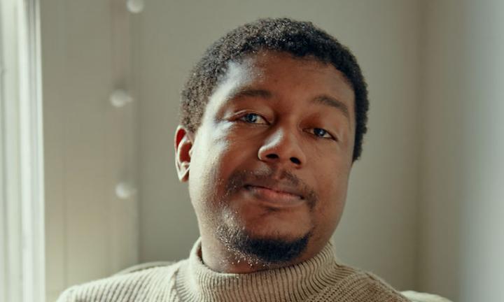 Derrick Austin looking at the camera