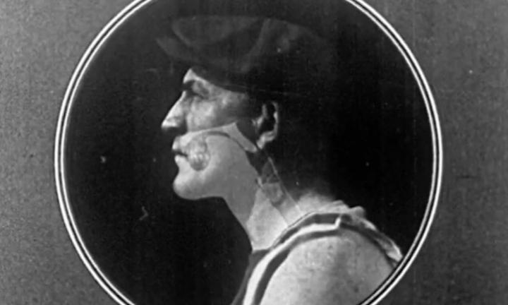 black-and-white image of a man in profile with overlay of anatomy of teeth and throat