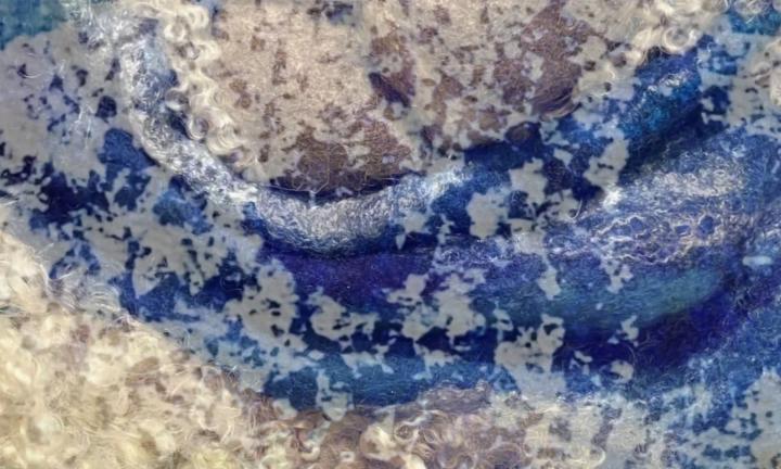 blue and beige fiber art with foam superimposed