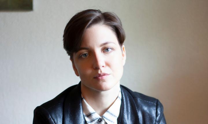 Poet K. Iver in black jacket