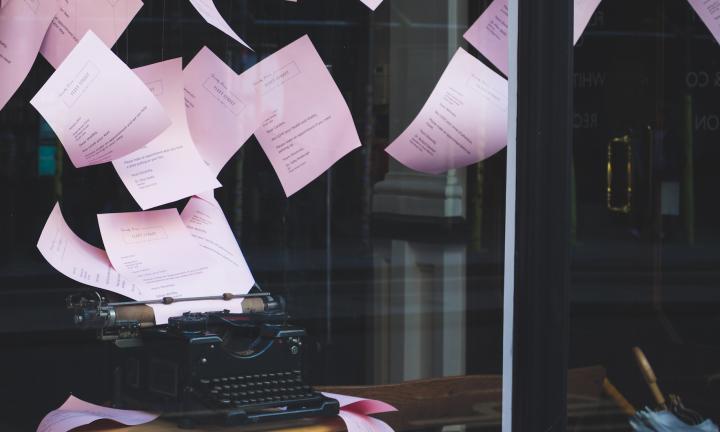 pages flying out a typewriter