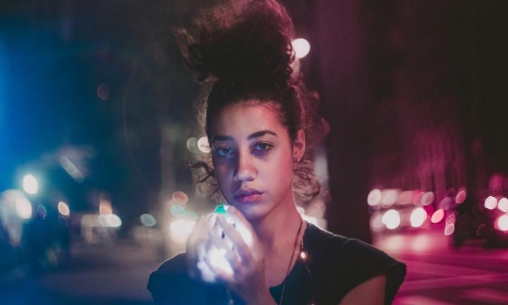 woman holding light street scene