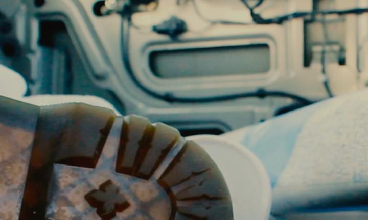 sole of a shoe, an empty styrofoam cup, a map rolled out with the metal of a stripped car door in the background