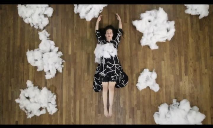 woman in the black dress with cotton clouds