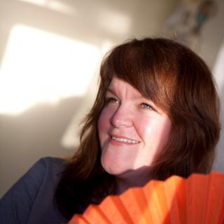 Genia Daniels with orange fan