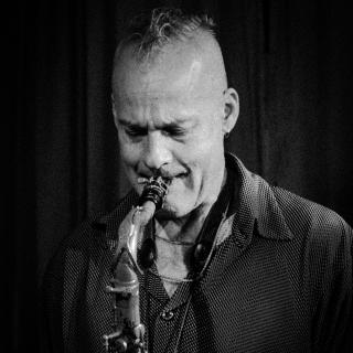 Publicity photo of saxophonist Dennis MItcheltree