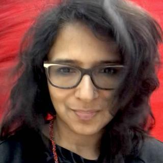 Author with glasses and red background