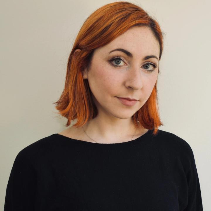 Lena Crown woman with shoulder-length red hair